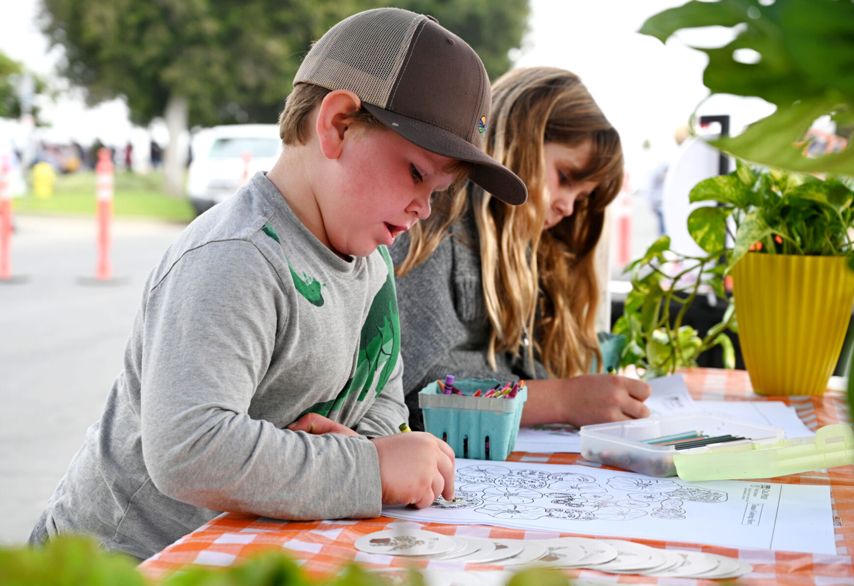Children draw and color produce as they learn about fruits and vegetables during the Santa Barbara County Farm Day Saturday.